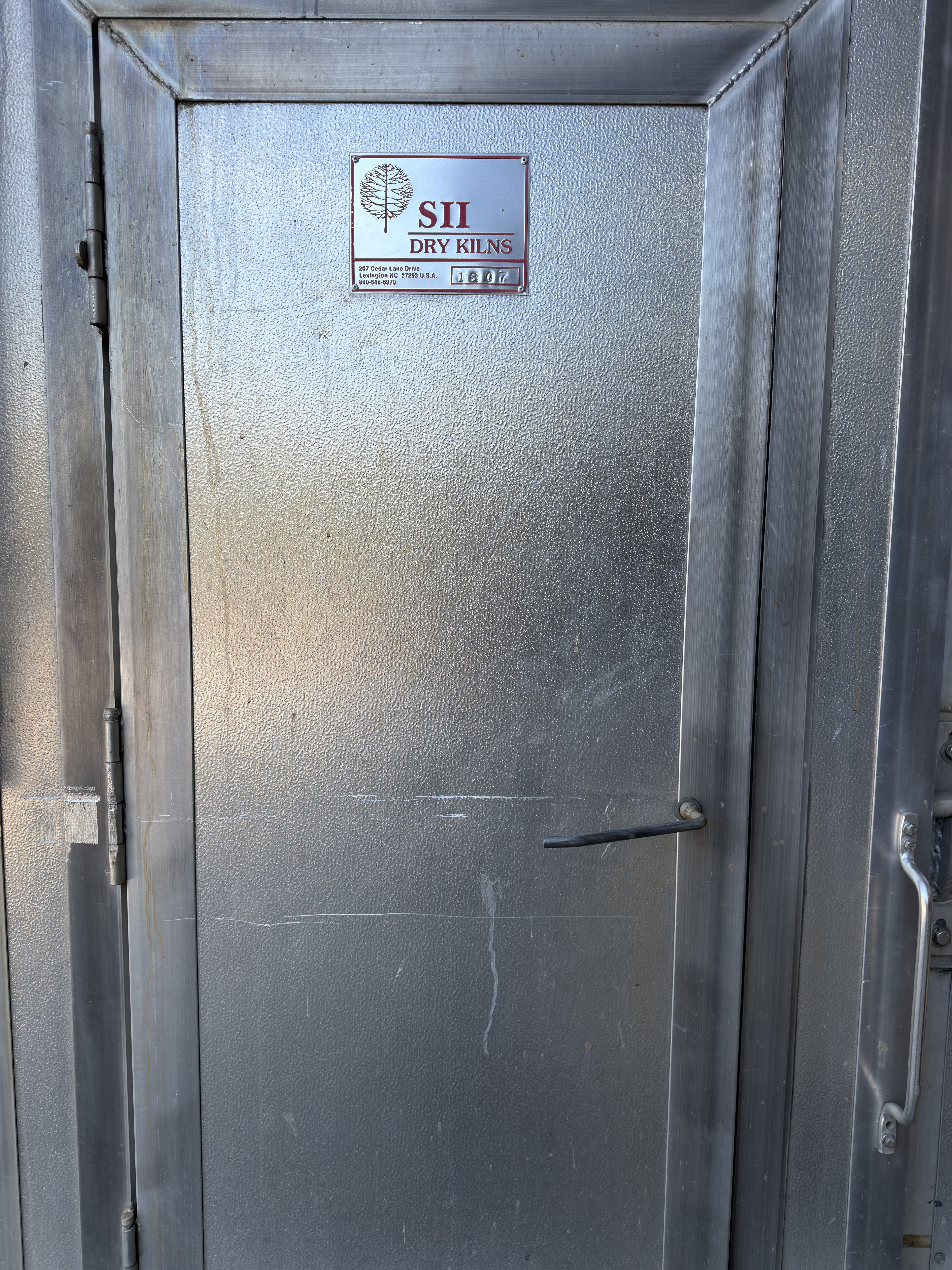 Door of Troymill's second SII dry kiln with its nameplate